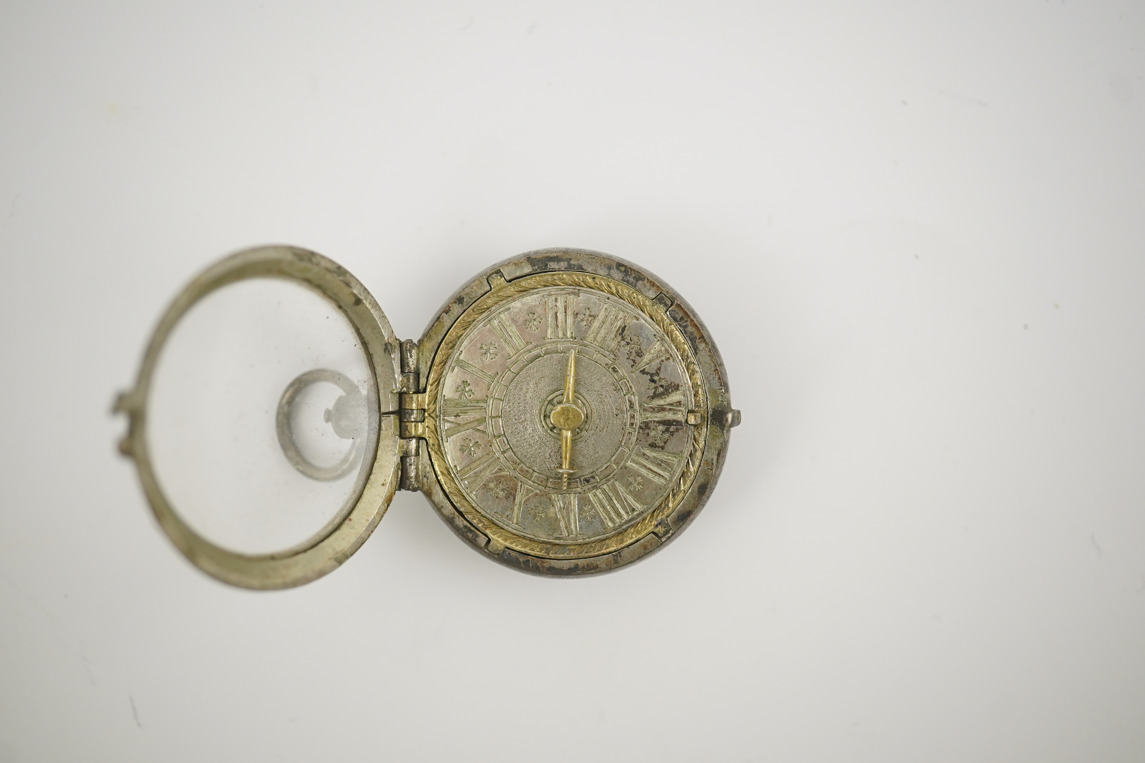 A 17th century style silver pill/poison box modelled as a single hand pocket watch